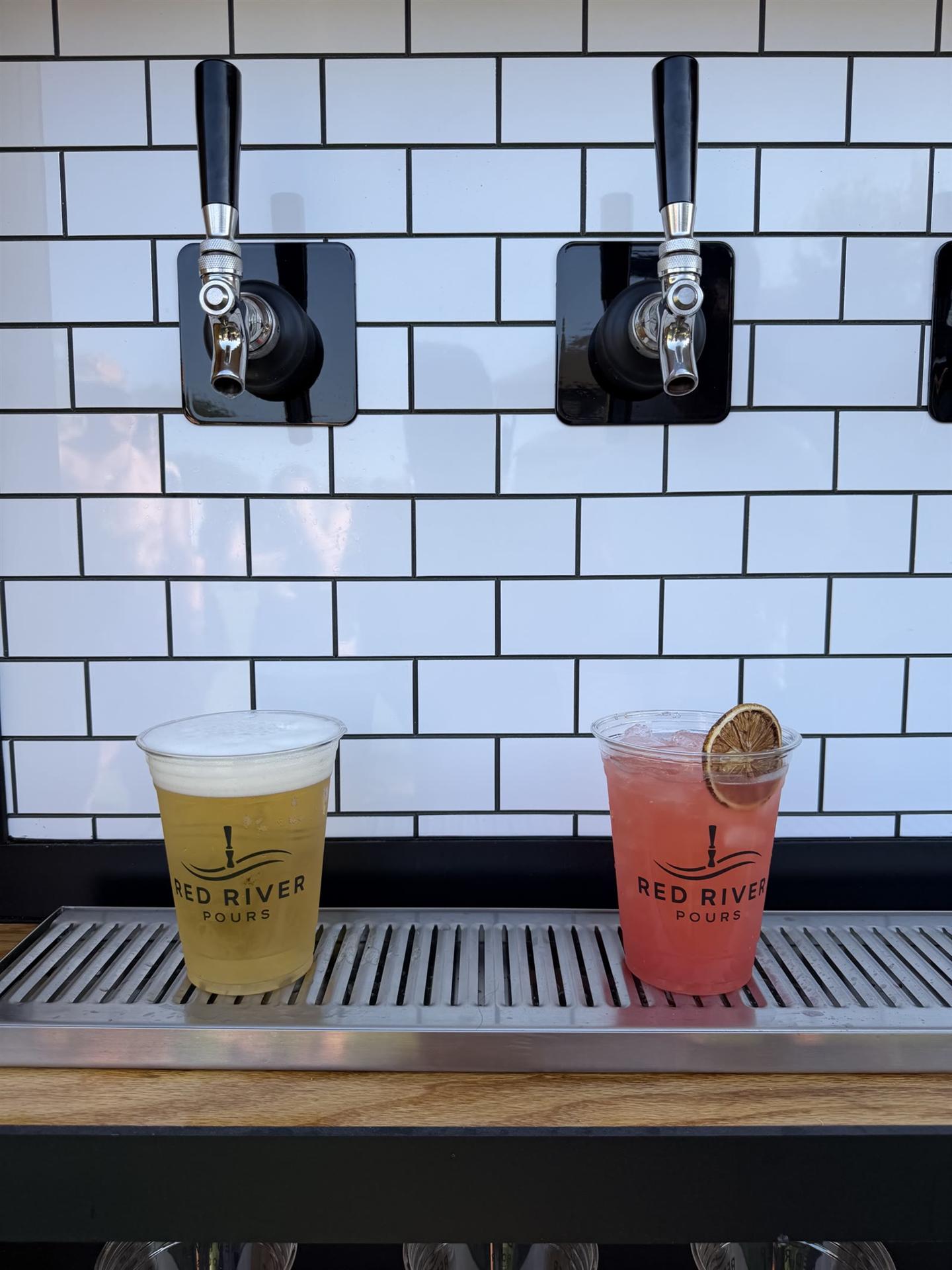 Beer and a signature drink in Red River Pours cups