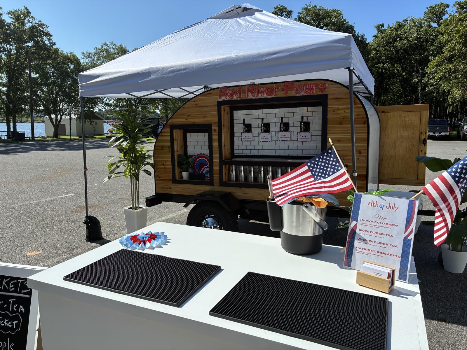 Full Red River Pours event setup with tent and serving table